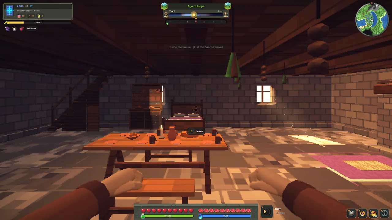 Inside a stone house: a table with a candle, a bed and a rug, sunlight through a small window.