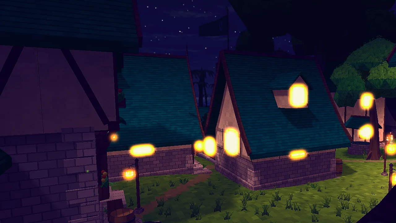 A village at night from a hillside: lit windows and lamp posts between the houses.