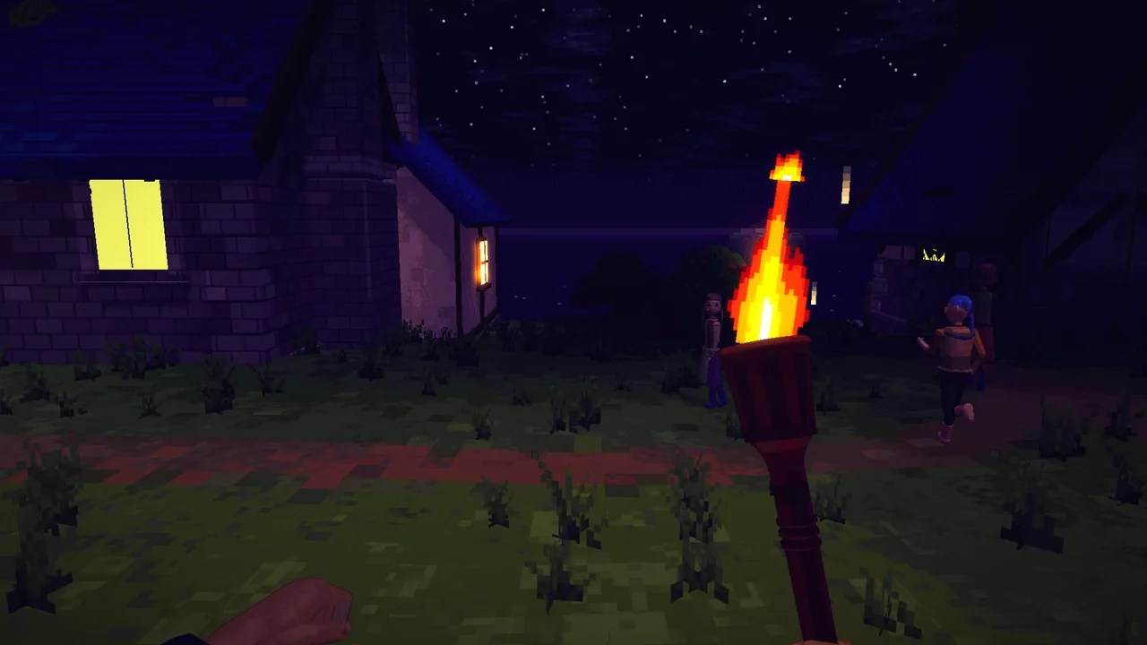 A torch held up at night between village houses, a lit window and villagers nearby.